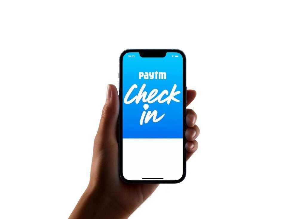 Paytm Checkin app on iPhone screen